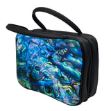 A rectangular vanity/cosmetic case with 2 black handles. The front and back of the cosmetic case display the inside of the iconic Kiwi Pāua shell with beautiful swirls of blue, green and purple. The sides are black, with a black zip around 3 sides. 