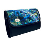A rectangular cosmetic bag with which secures with a Velcro strip across the top. The front of the bag the inside of the iconic Kiwi Pāua shell with beautiful swirls of blue, green and purple. The front left corner hosts a silver badge with the AA Traveller logo. The back and sides are black, with a black Velcro strip and unfolds into 4 compartments. 